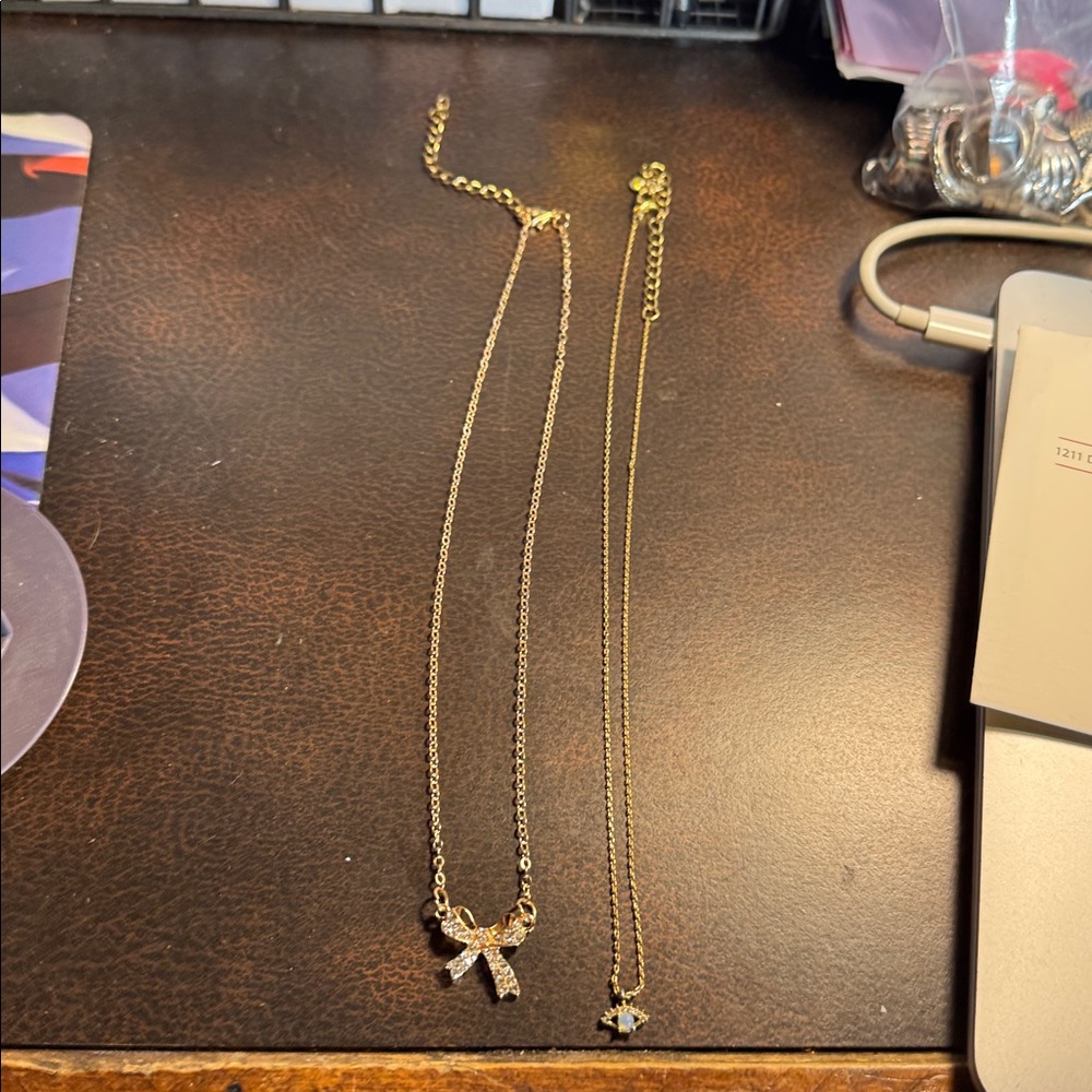 Gold Tone Bow and Star Necklaces